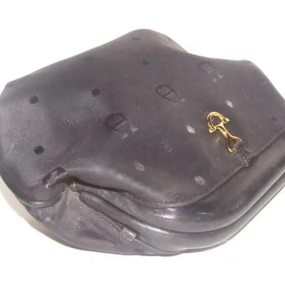 Etienne Aigner black logo design nylon and black leather, clutch or cosmetic bag with gold tone logo accents, a hinged opening