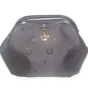 Etienne Aigner black logo design nylon and black leather, clutch or cosmetic bag with gold tone logo accents, a hinged opening