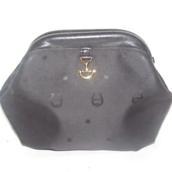 Etienne Aigner black logo design nylon and black leather, clutch or cosmetic bag with gold tone logo accents, a hinged opening