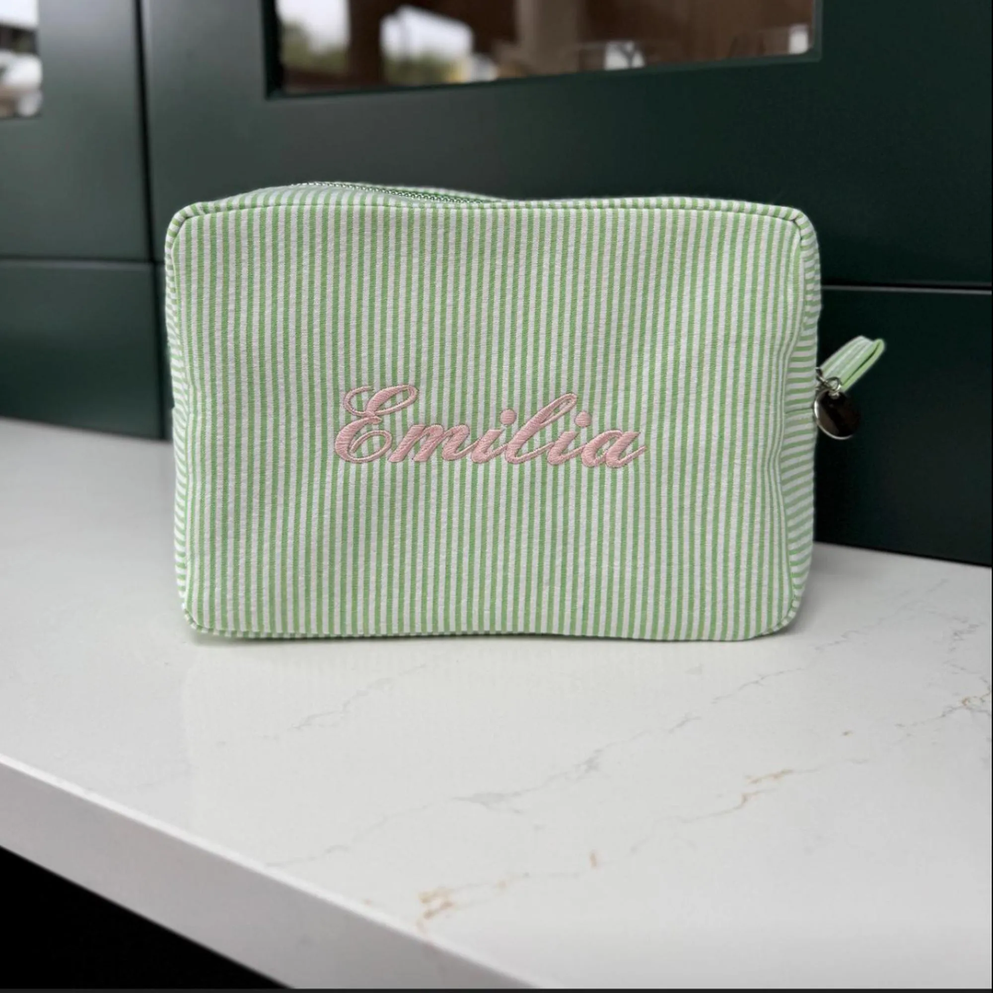 Monogramed stripe cosmetic bag